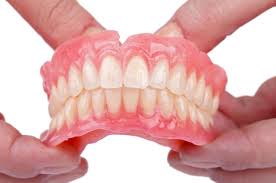 permanent false teeth price